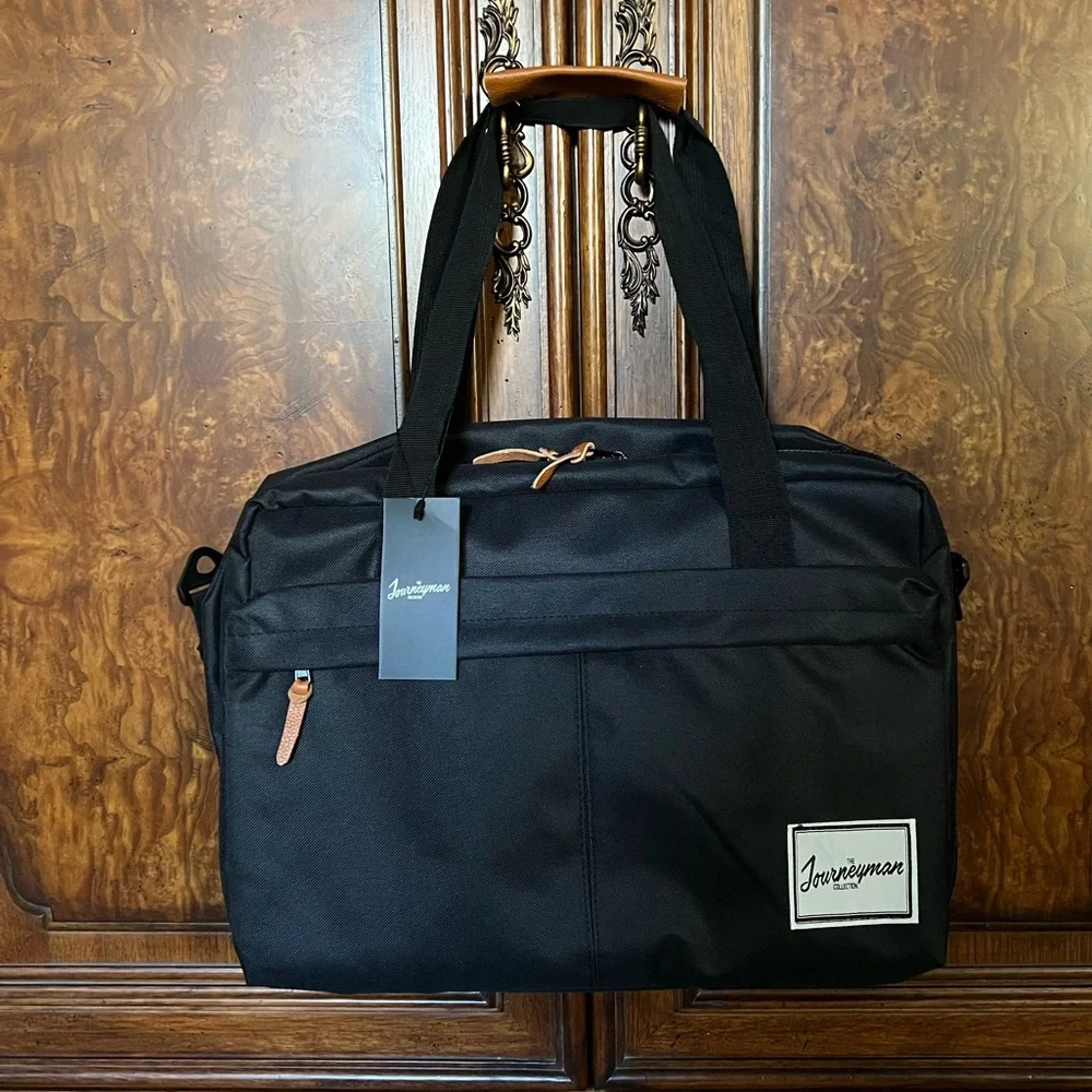 NWT The Journeyman Bag Co Duffle Bag in black with red mesh interior.